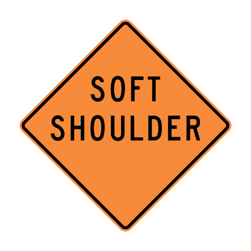 Orange diamond sign with the black words SOFT SHOULDER.
