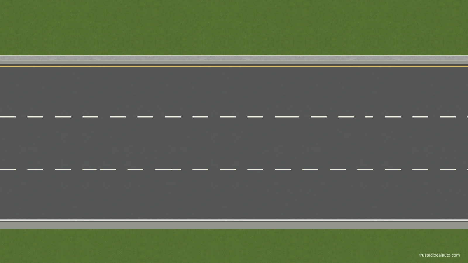 An empty multi-lane carriageway with white dashed lane dividers and continuous road edges.