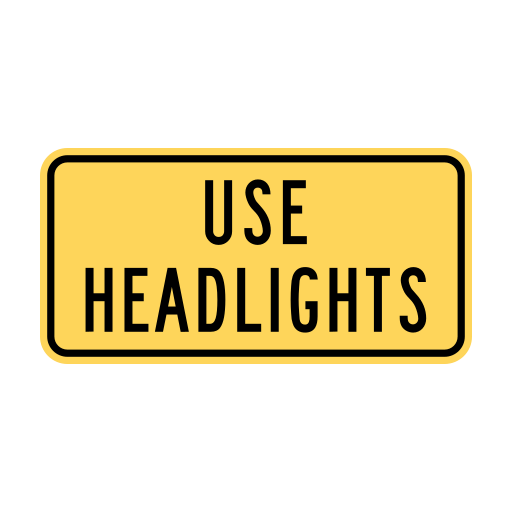 B.C. road sign W-030-TC displaying Use headlights.
