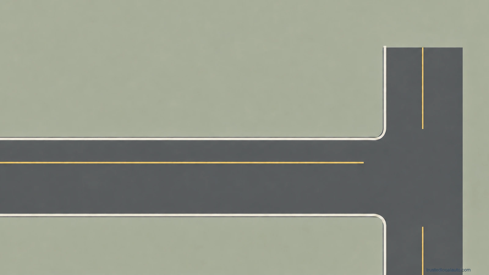 An empty approach meets a T junction. The question has no vehicle, signal lamp, route or distance ruler.