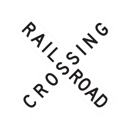 Two white boards cross diagonally in an X, with the black words RAILROAD CROSSING.