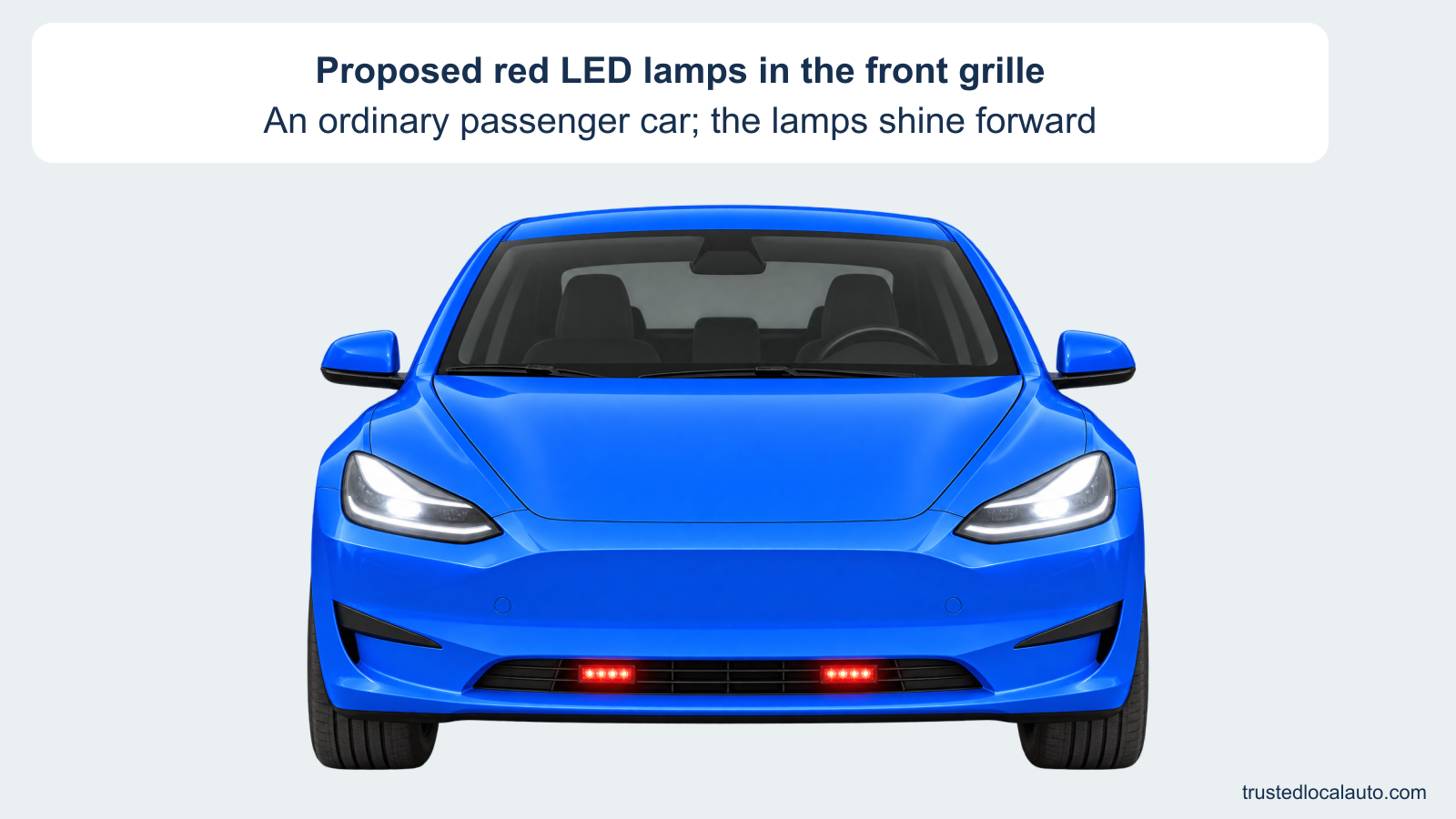 Front of an ordinary blue passenger car with two standard white headlights illuminated and two small red LED modules in the grille shining forward. The card identifies the proposed red front lights without stating whether they are permitted.