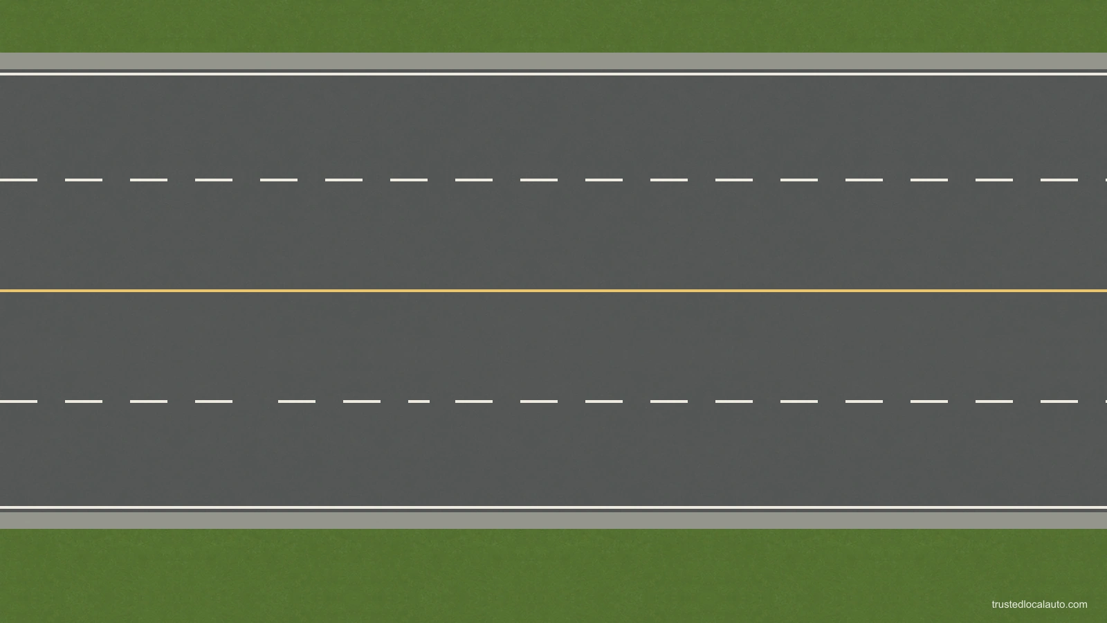 Empty multi-lane road with a yellow centre line and broken white lane lines. No vehicle, travel arrow or direction caption remains.