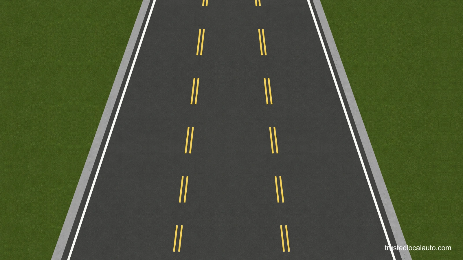 An empty three-lane roadway. Paired broken yellow lines run along both sides of the centre lane, with white lines at the outer road edges.