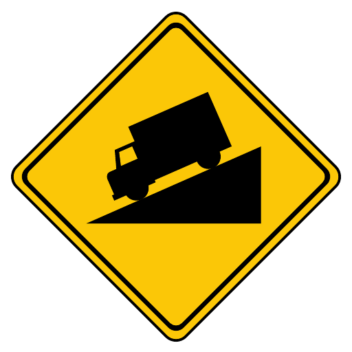A yellow diamond shows a black truck facing down a triangular slope; the official face has no numerical grade.