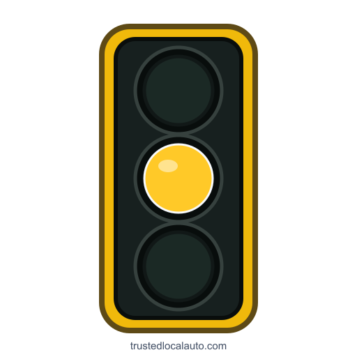 A vertical traffic signal shows a bright steady yellow middle lens; the upper red and lower green lenses are dark.