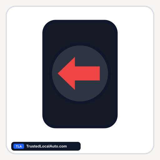 A red left-pointing arrow illuminated in a dark traffic-signal lens.