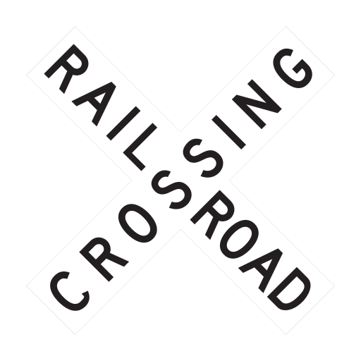 Two white boards form an X and carry the black words RAILROAD CROSSING.