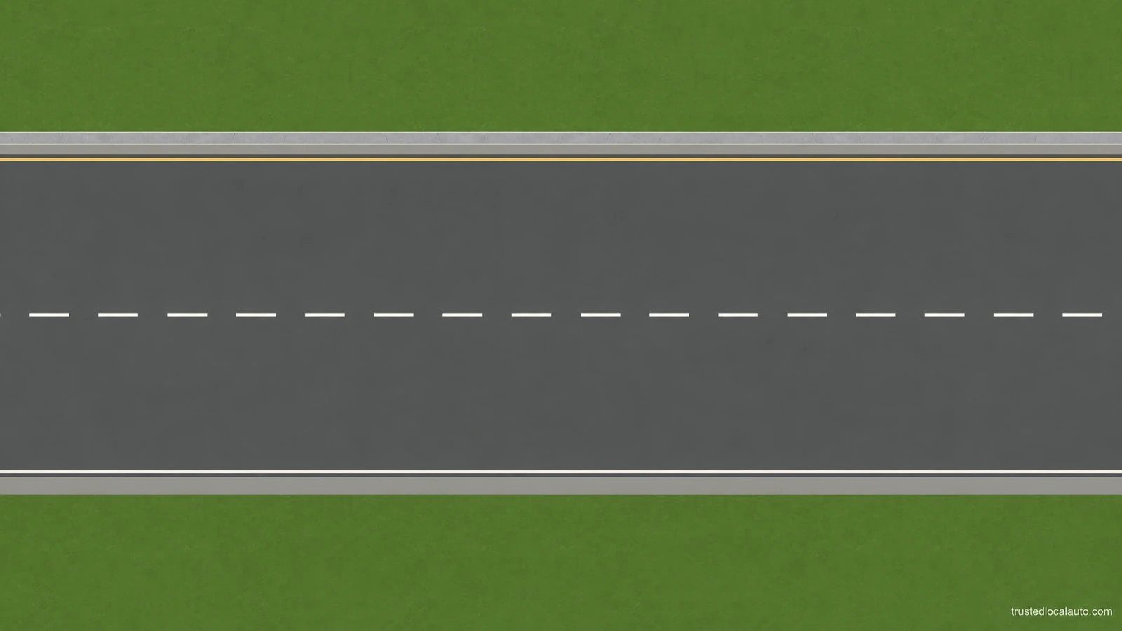 An empty road has a broken white line between two paved lanes and a yellow line along the far side.
