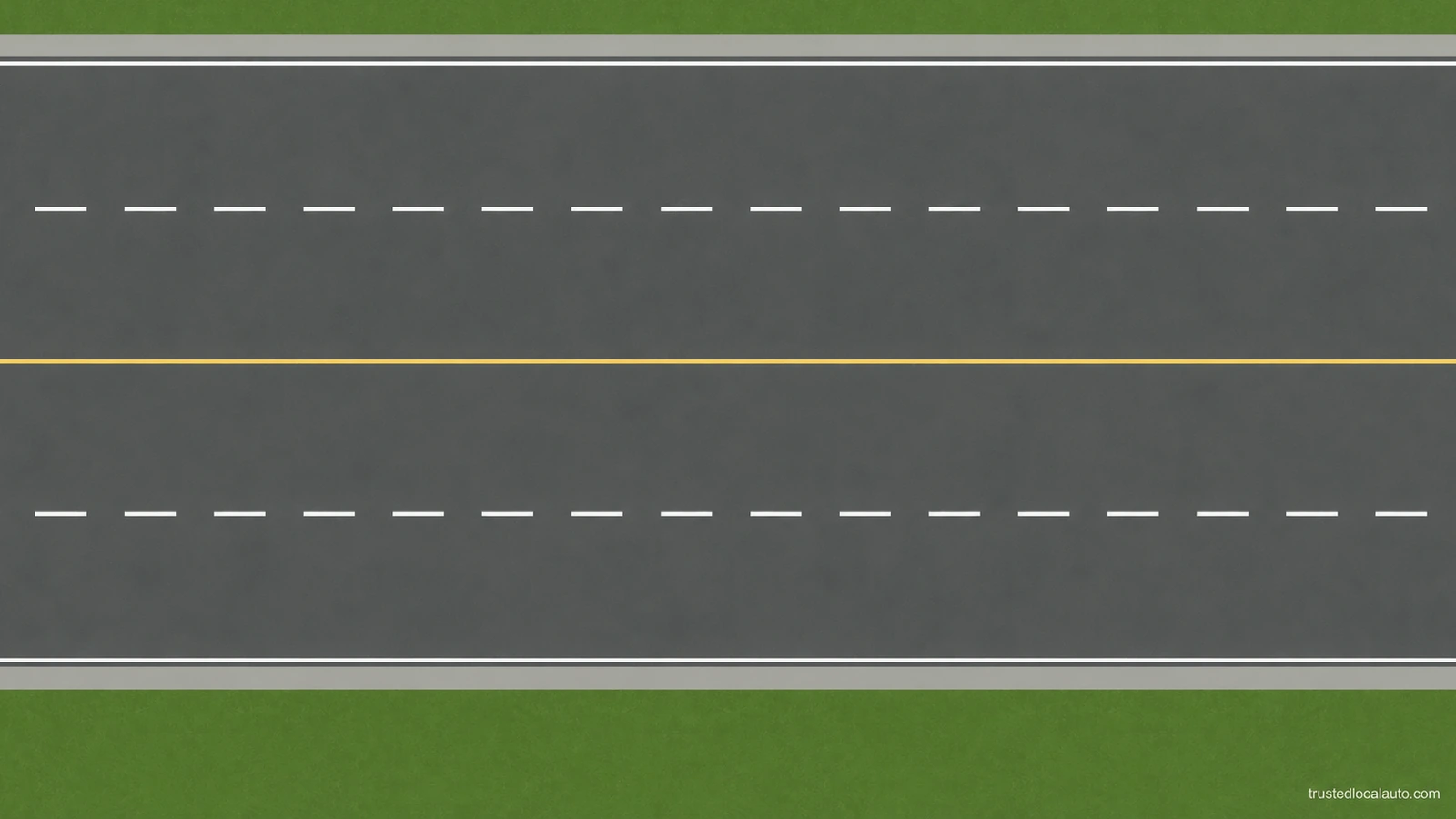 The empty road has white dashed lane dividers and a yellow centre line; no vehicles or movement arrows are present.