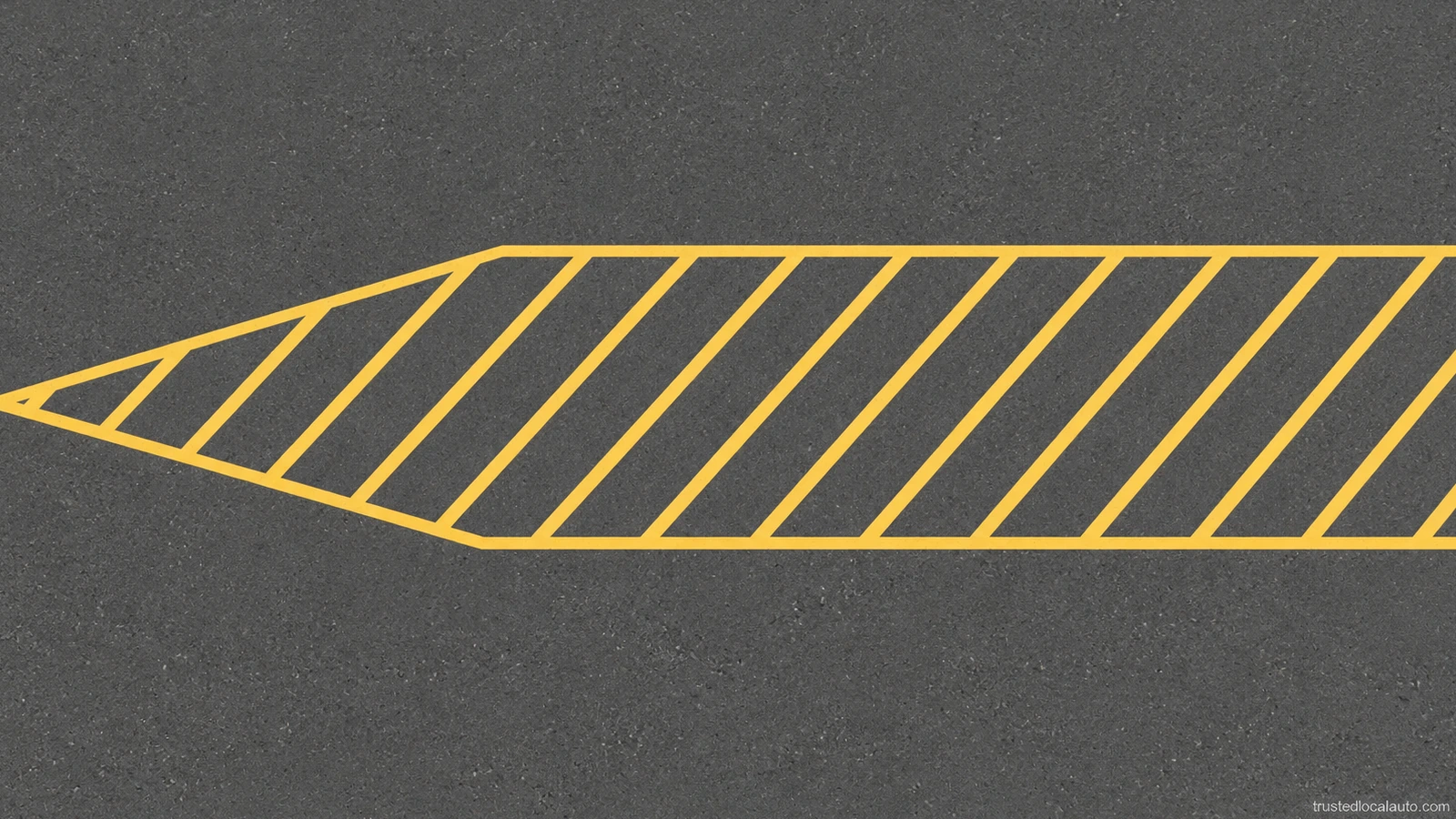 A close detail shows diagonal yellow hatching within yellow boundary lines on flat asphalt. No vehicle or direction of travel is visible in this detail.