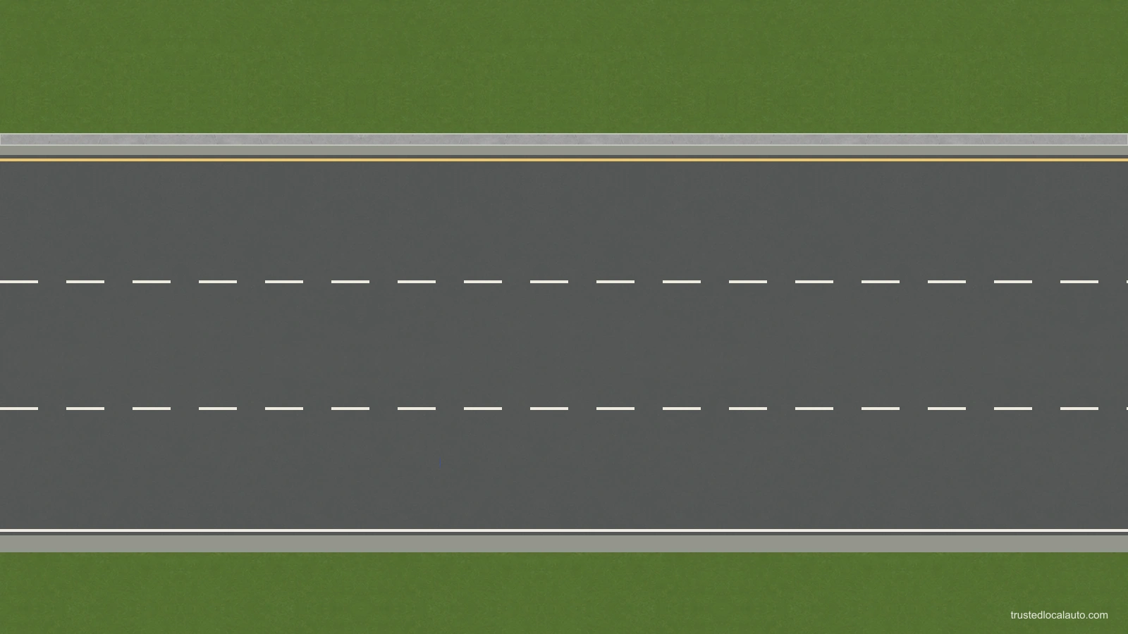 An empty three-lane freeway has a median beside its left edge and a shoulder outside the white right edge line. No car, route or selected lane is shown.