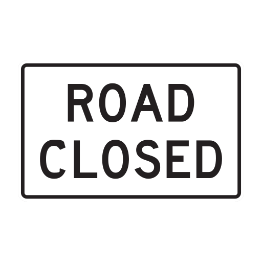 A horizontal white rectangular sign reads ROAD CLOSED within a black border.