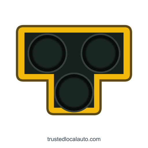 Front view of a pedestrian hybrid beacon: two dark upper lenses side by side and a third dark lens centered below.