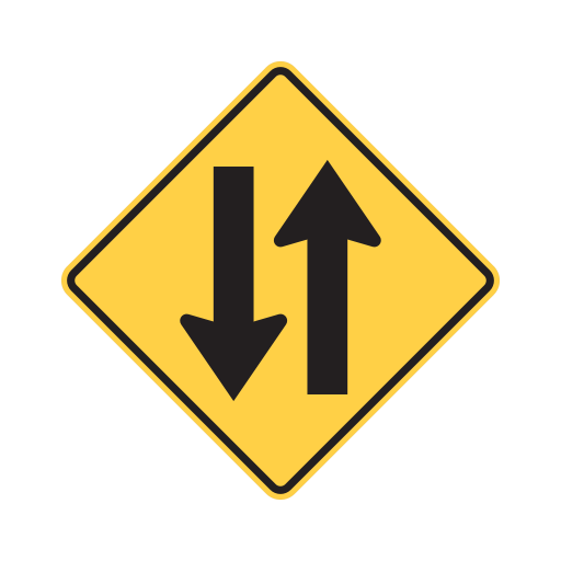 Yellow diamond sign with two vertical black arrows pointing in opposite directions.